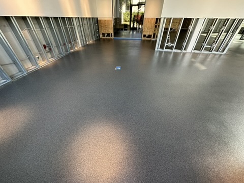 Charcoal flake epoxy floor in a warehouse in Naples, FL