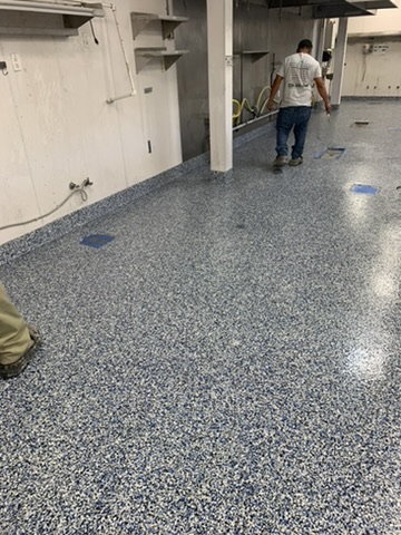 Blue and gray flake epoxy floor in a commercial kitchen in Naples, FL