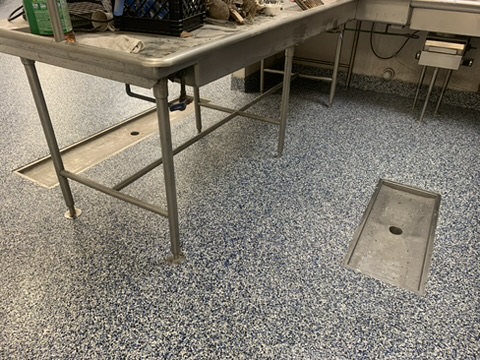 Flake epoxy floor with floor drains in a commercial kitchen in Naples, FL