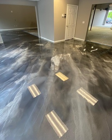 Gray and white swirled metallic epoxy floor in Naples, FL