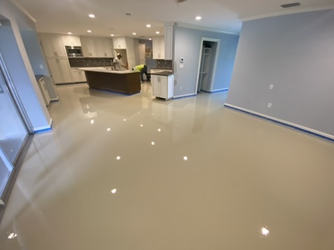 Cream metallic epoxy floor in a residential kitchen in Naples, FL