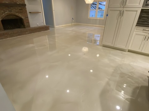 Pearl metallic epoxy floor in a residential living room in Naples, FL