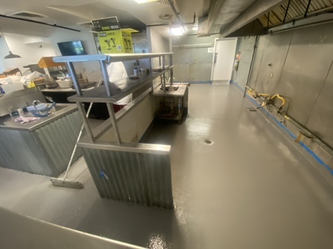 Solid gray epoxy floor in a commercial kitchen in Naples, FL