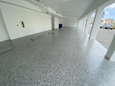 Flake coating on an exterior walkway leading to a Cape Coral pool enclosure