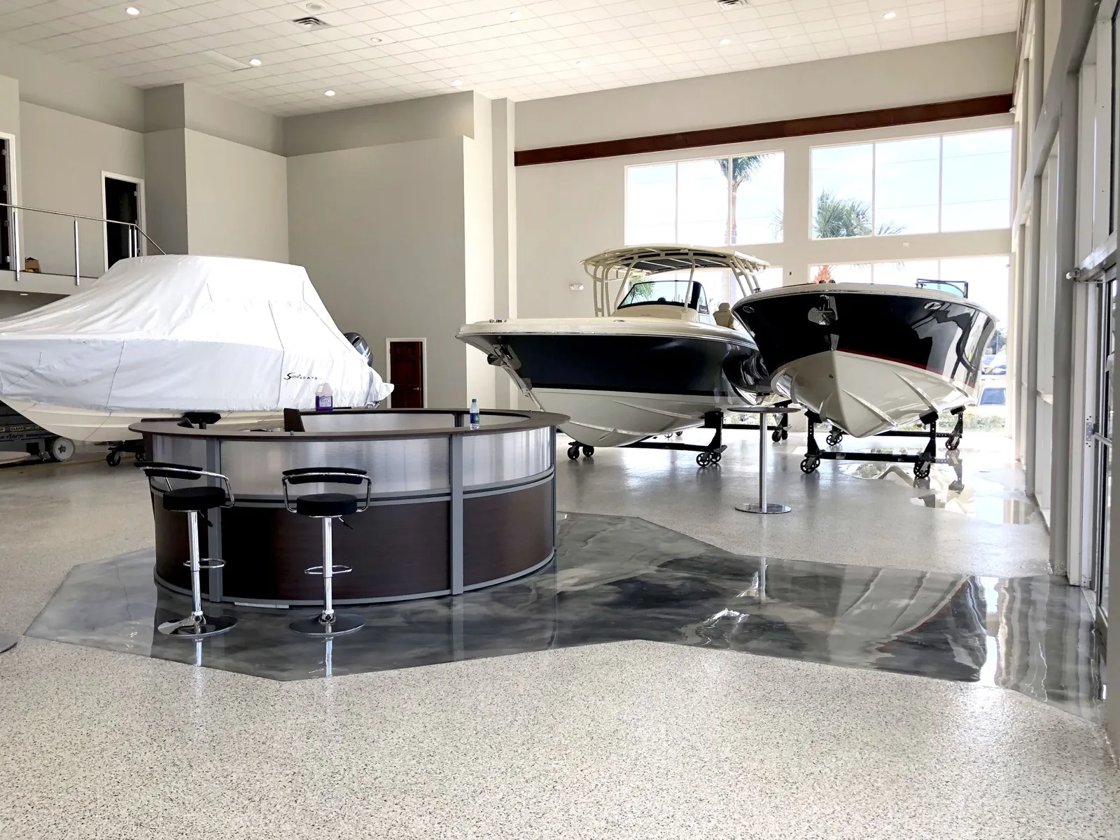 Marine boat showroom dealership floor with metallic charcoal epoxy