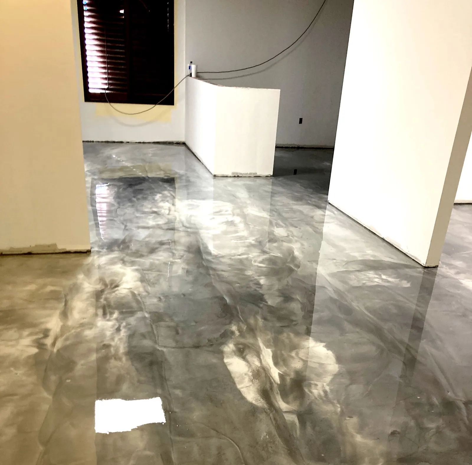 Silver and white metallic epoxy floor in interior space